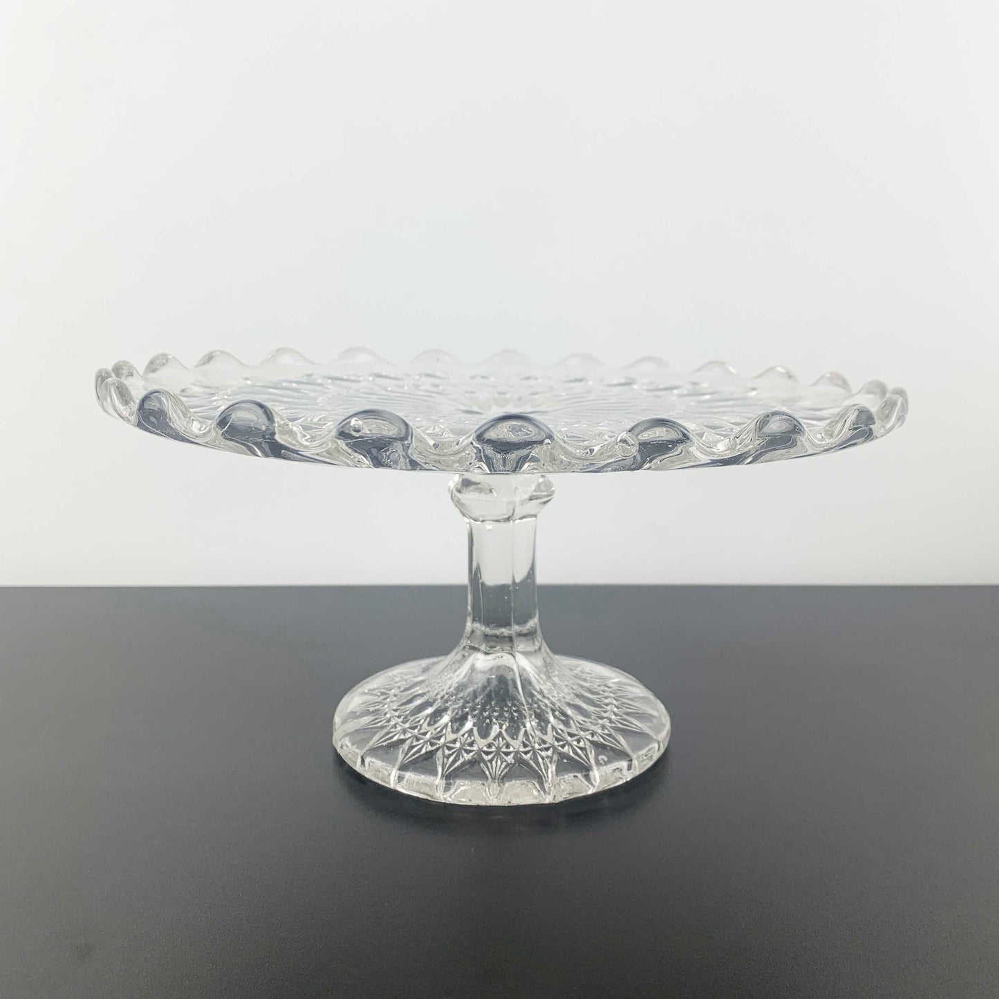 Vintage pressed glass footed cake stand