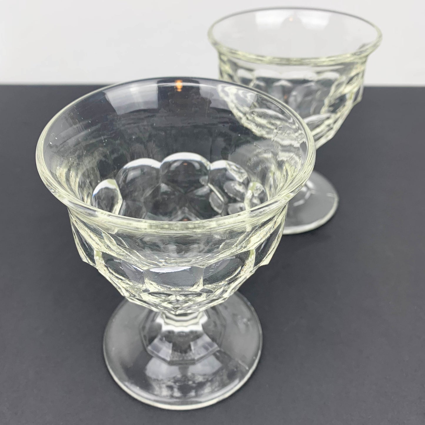 Pair of unique scalloped glass footed bowls top view
