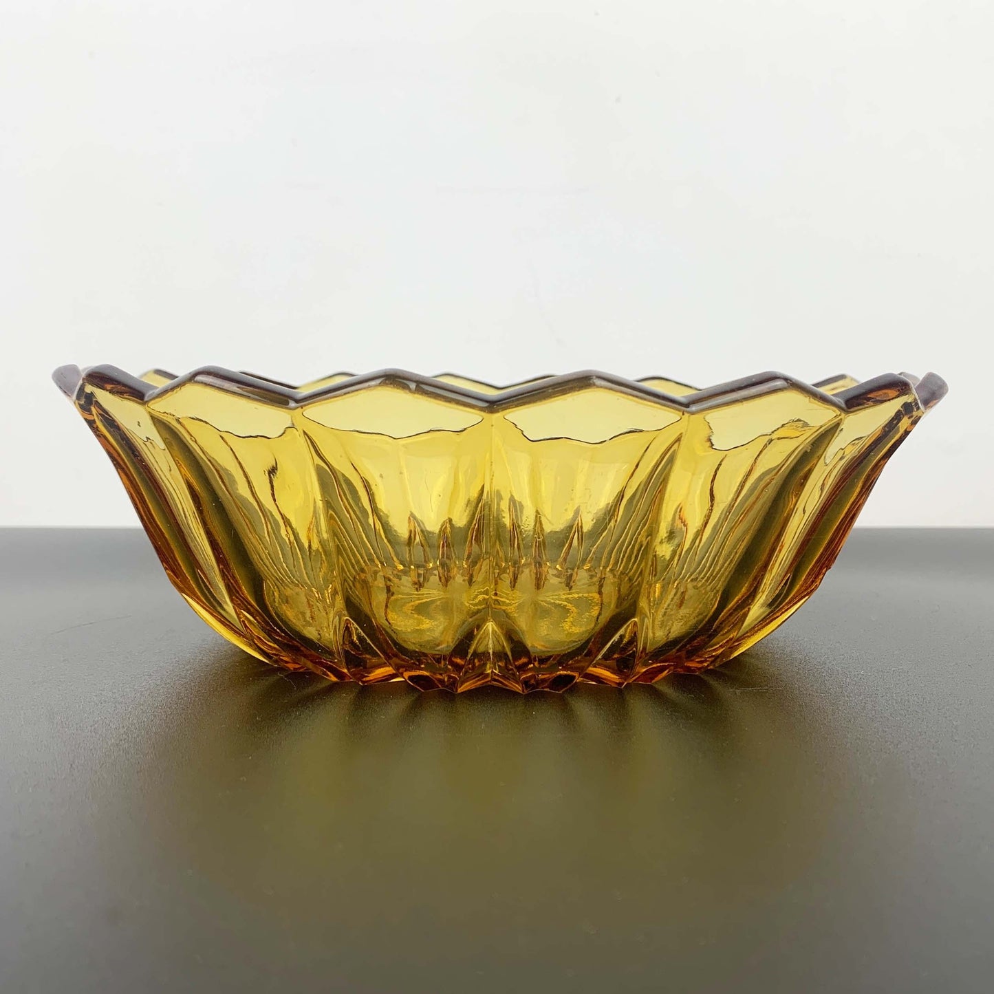 Amber glass salad bowl with scalloped triangle rim