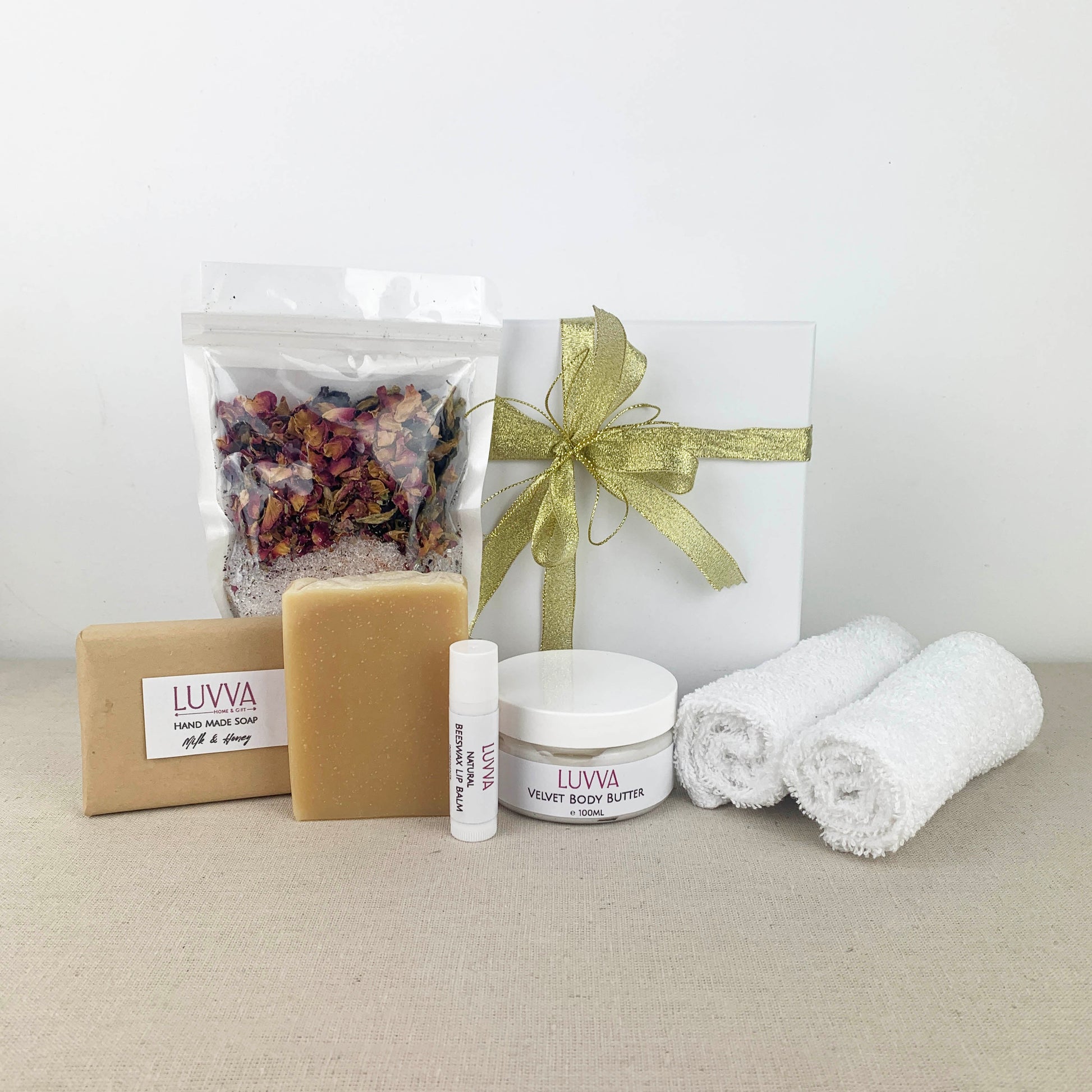 Collection of LUVVA skincare and wellness products with gift box