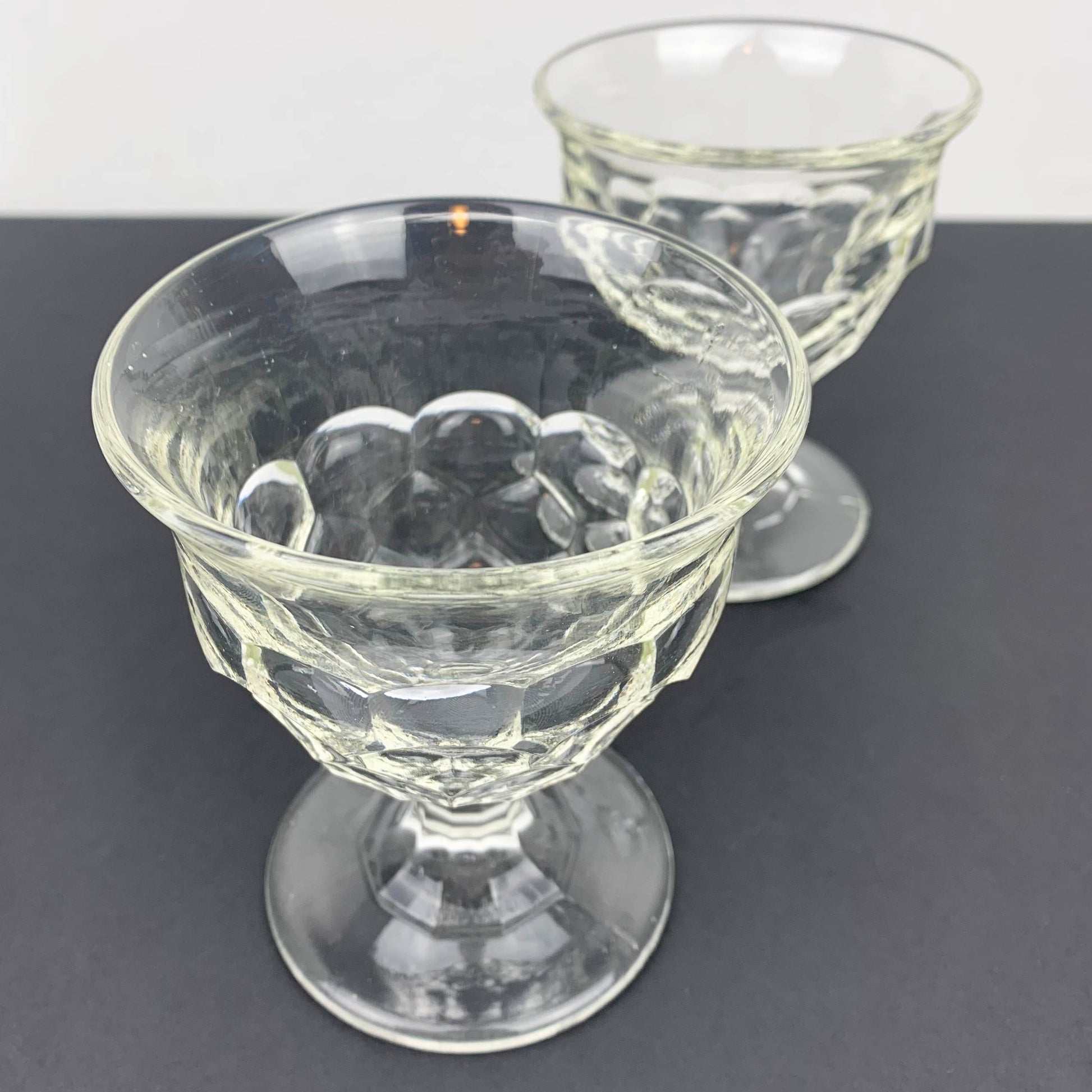 Pair of unique scalloped glass footed bowls top view
